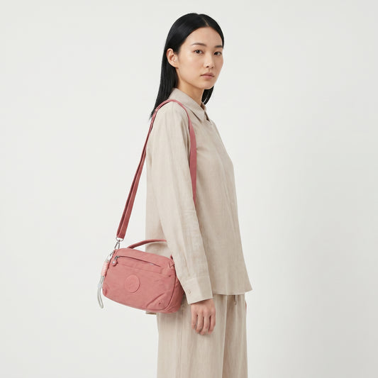 Bolsa Transversal Feminina em Nylon com Múltiplos Bolsos Rosa